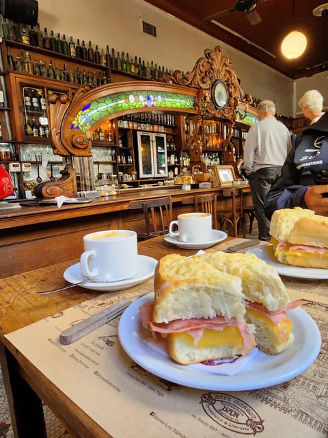 Walking Tour of San Telmo and La Boca with local food - A drink with Maradona at the end